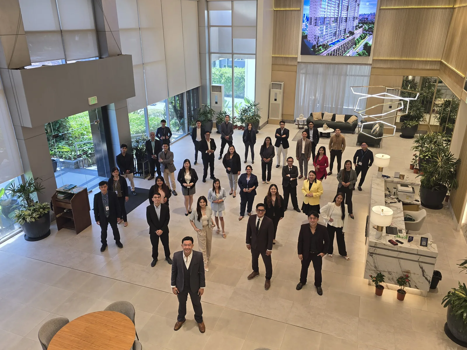 Team Elite, the DMCI Homes sales group led by Warren Rafal, gathered in The Valeron Tower showroom lobby